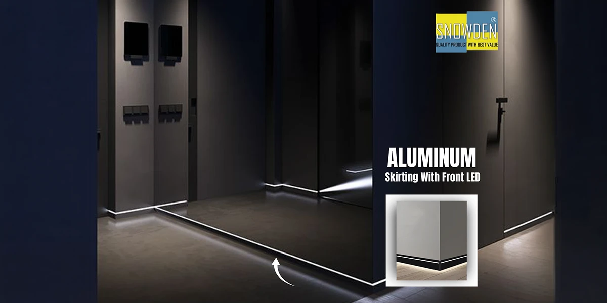 A dark, modern hallway featuring sleek aluminum skirting with integrated front-facing LED lighting provided by a professional Aluminum Skirting Supplier.