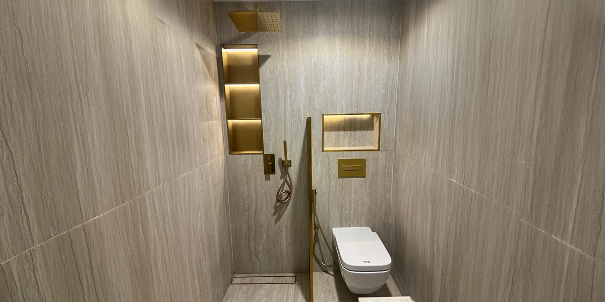 Floor drain supplier showcasing a linear floor drain in a modern tiled bathroom