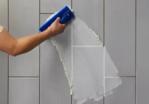 Professional wall tile grouting using products from a trusted Tile Grout Manufacturer in UAE
