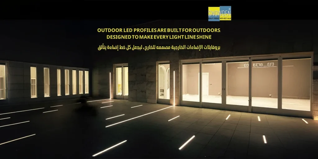 Modern outdoor patio at night featuring in-ground linear light strips produced by a professional LED profiles manufacturer.